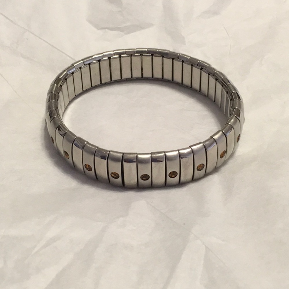Silver Bracelet, Flexible with small Topaz looking Crystals. Expands to fit all